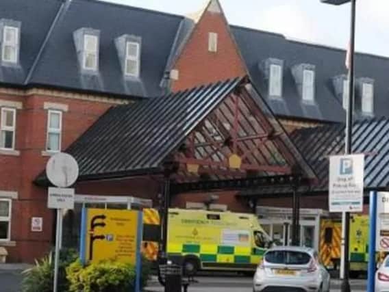 Wigan Infirmary bosses have warned people to stay away unless necessary