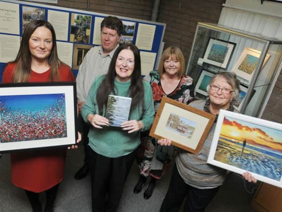 From left, Artist Hazel Hobson, photographer Glyn Davies, poet Sue Gerrard, volunteer exhibition co-ordinator Vicky Barrow and artist Dorothy Merry - local artists display their work throughtout December at The Village Art Gallery at Shevington Library.
