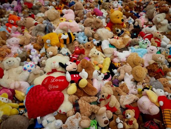 Some of the 2,000 teddy bears left as tributes to children
