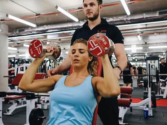Fitness instructor Mark Bohannon puts TV star Gemma Atkinson through her paces