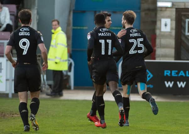 Nick Powell takes the celebrations from his colleagues at Northampton