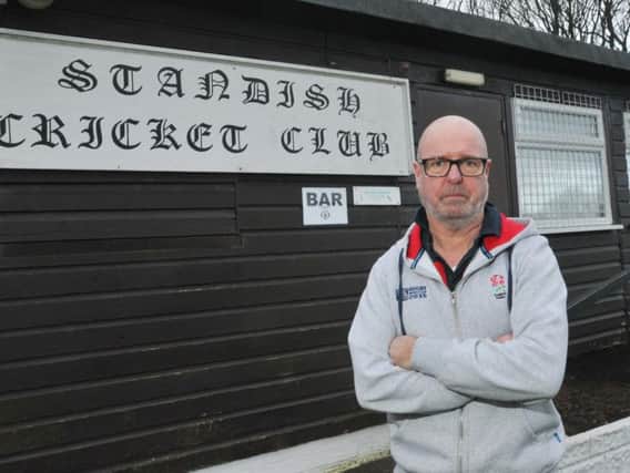 Ian Stewardson, treasurer of Standish Cricket Club, looks at the damage after the building was broken into and bar stock was stolen