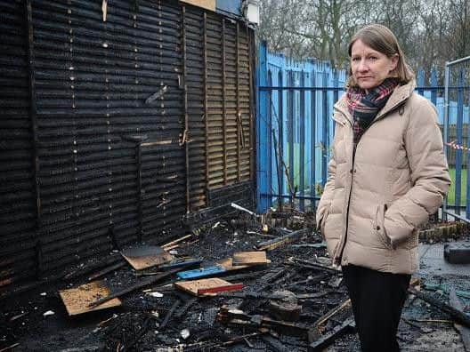 Headteacher Monica Middlehurst cleaning up the damage after the fire at RL Hughes Primary School