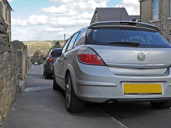 Do parked cars and vans cause problems for blind people? See letter