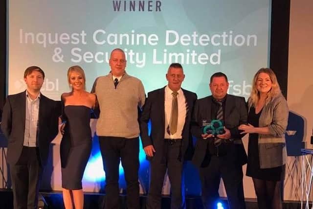 Inquest Canine Detection & Security Limited management team collecting their FSB training and development award: Tamsin Preston, Phil Johnson, Dave Stones (explosive dog handler) and Dean Porter