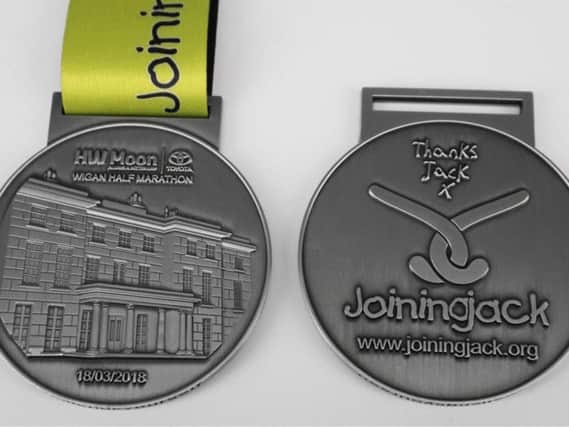 The front and back of the Wigan half marathon medal