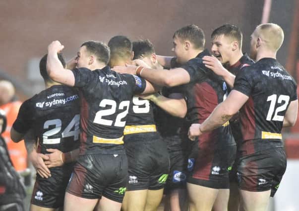 Wigan celebrate a friendly victory at Leigh