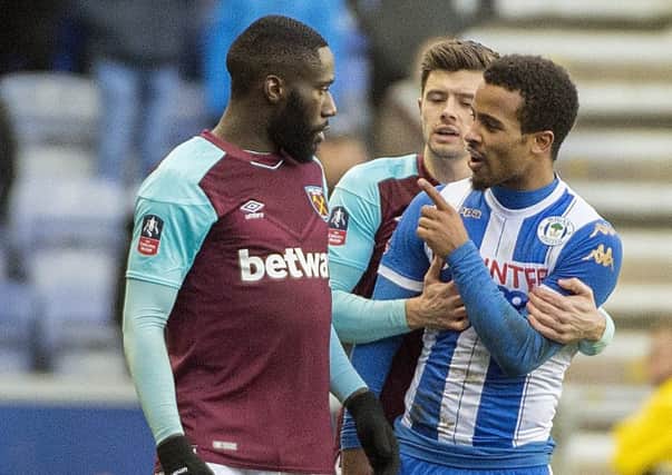 Arthur Masuaku was sent off against Latics for spitting