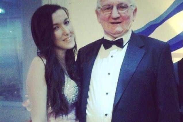 Sinead, pictured with her grandfather, during her school days