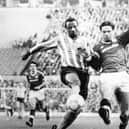 Cyrille Regis in action for Coventry battling with Manchester United's John Sivebaek (photo: PA)