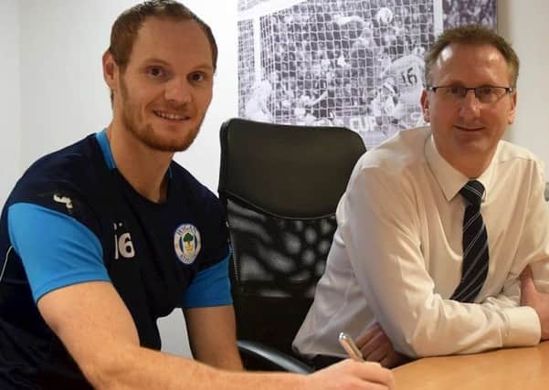 Shaun MacDonald signs his new deal
