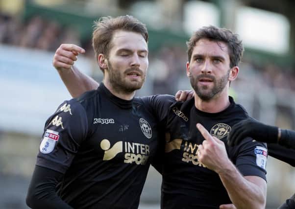Nick Powell, with Will Grigg