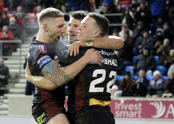 Sam Tomkins, Oliver Gildart and Liam Marshall celebrate