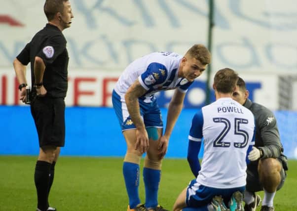 Nick Powell receives treatment