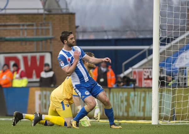 Will Grigg scores the opening goal against Gillingham