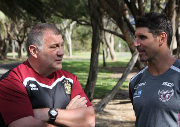 Shaun Wane caught up with former Wigan player Trent Barrett, the Manly coach, during training