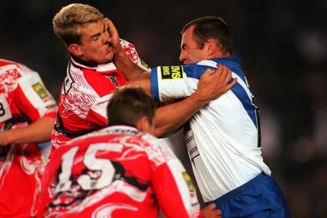 Gary Connolly gets a fend from Daryl Halligan during the '97 win against Canterbury