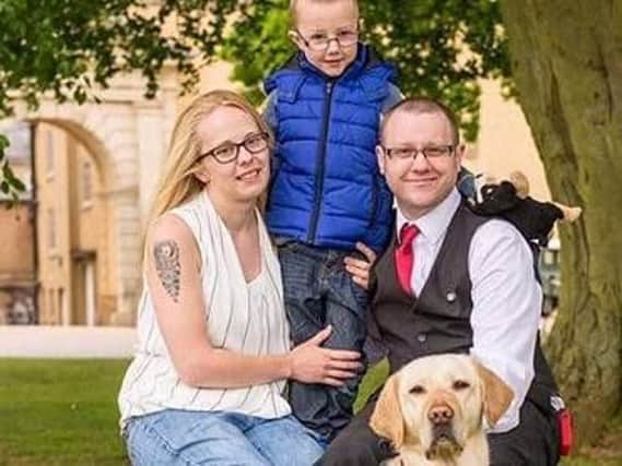 Chris and his wife Samantha with son Jayden and Jade the hypo alert dog