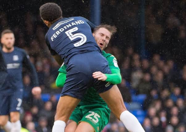 Nick Powell is poleaxed by Anton Ferdinand at Southend