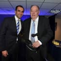 Brian Sabin is presented with the Latics 'Fan of the Year' award by Roberto Martinez