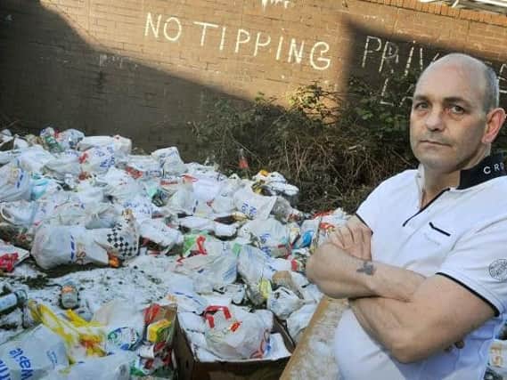 James Lang sees rubbish being thrown behind his flat on a daily basis
