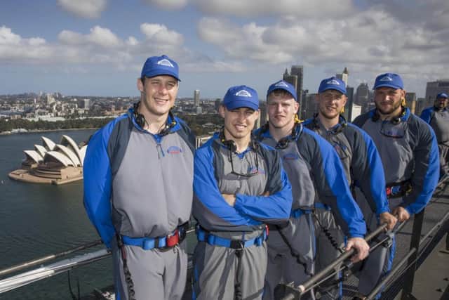 Wigan players Joel Tomkins and Sam Powell climb the Sydney Harbour Bridge with Hull's Brad Fash, Jack Downs and Josh Griffin. Picture: Destination NSW