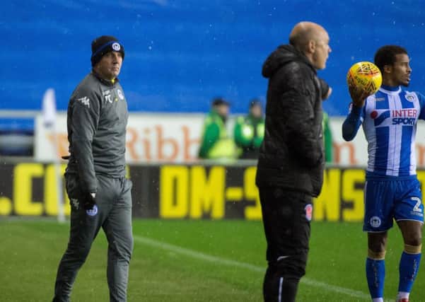 Uwe Rosler, with Paul Cook, at the DW Stadium for Fleetwood's 2-0 defeat to Latics in December