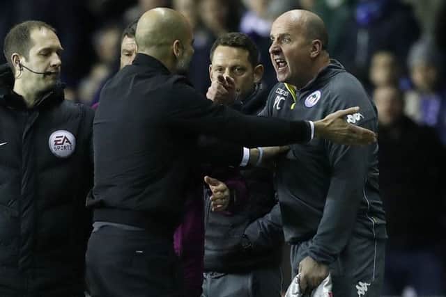 Paul Cook has a slight difference with Pep Guardiola after Fabian Delph's red card