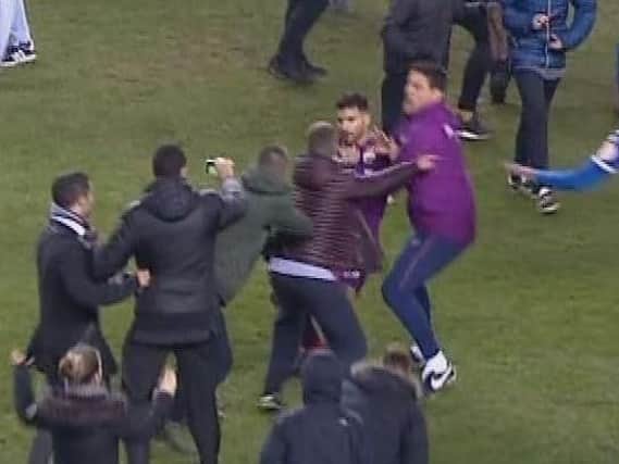Aguero jostles with fans at full time