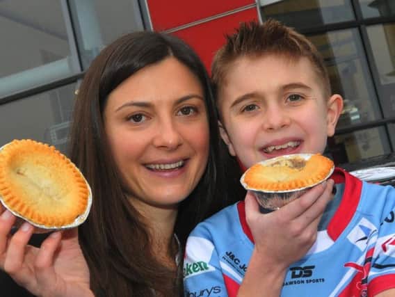 Ten-year-old Jack Johnson and mum Alex tuck into their pies