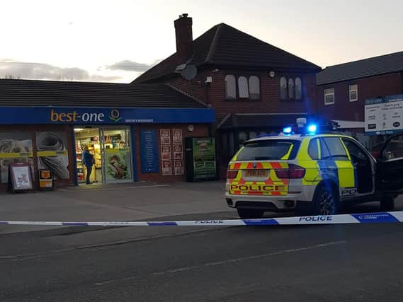Police swarmed the Best One shop in Golborne