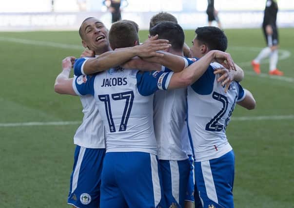 Wigan Athletic players celebrating yet another goal this year