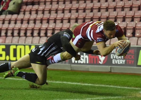 Joe Burgess dives in at the corner  against Widnes