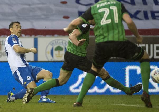 Gary Roberts scores against Scunthorpe