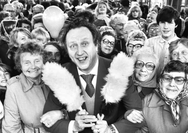 Comedian Ken Dodd with fans after opening the newly refurbished Makinson Arcade in November 1984