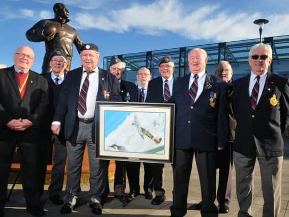 RAF veterans with a picture of the Wigan and District Spitfire