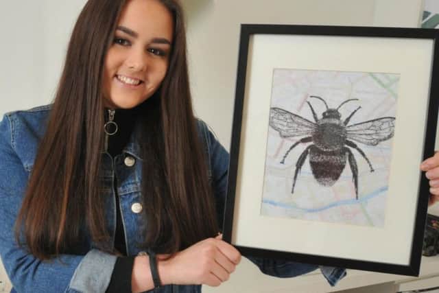 Charlotte Jeacock with her Manchester bee image