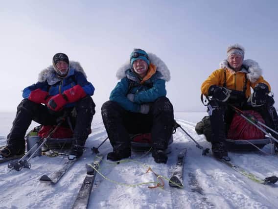 Michael Stevenson (centre) was part of a three-man team to set a new  record for crossing the world's largest freshwater lake. Pictured with team mates Scott Gilmour and Rob Trigwell. Photo by Scott Gilmour