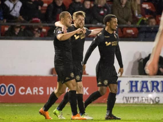 Michael Jacobs celebrates with James Vaughan and Nathan Byrne