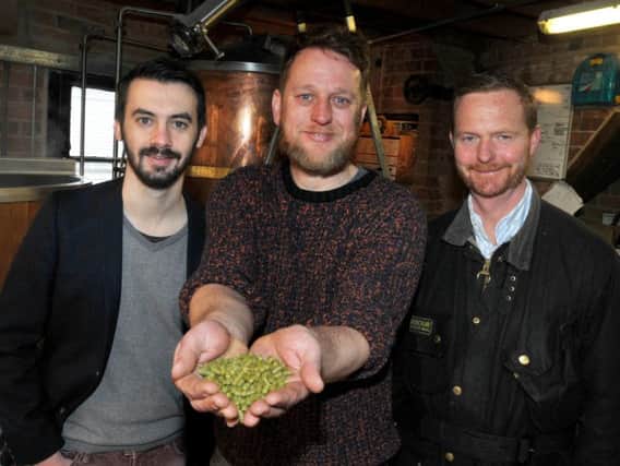 The ambassador from Angers Martin Pouvoeau, brewer Jonathan Provost and managing director Martin Blythe, at Wigan Brewhouse