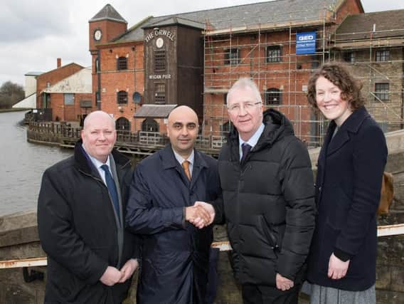 Gareth Smith, Harinder Dhaliwal and Laura Turley of Step Places, with Coun David Molyneux, and inset an artists impression of the new development