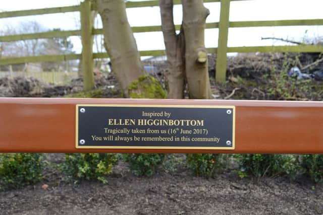 A close-up of the bench showing the plaque for Ellen