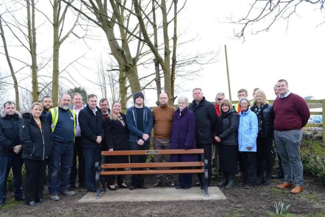 Ellen's father, boyfriend and family with Councillor Kevin Anderson, Councillor Joanne Marshall (lead member for greenspaces), Paul Barton (director for environment), Louise Tipping and representatives from the community by the memorial bench