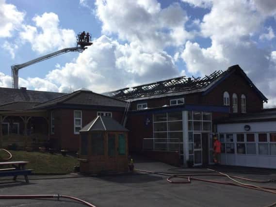 Firefighters remain at the school. Pic: Greater Manchester Fire And Rescue Service