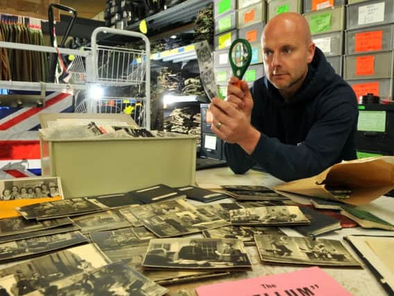 Scott Felton analysing some of the treasure trove of George Formby memorabilia