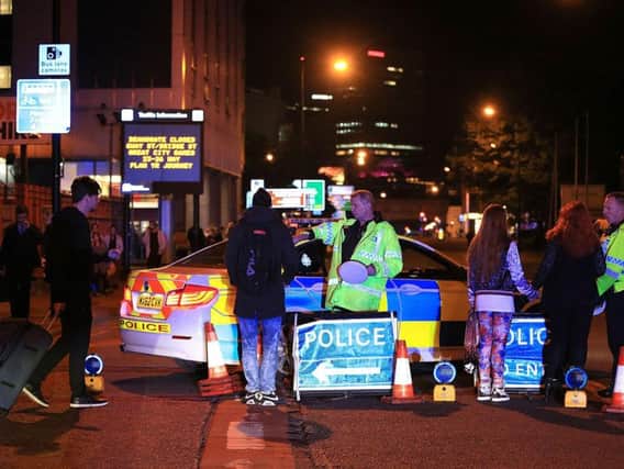 Emergency services at Manchester Arena after reports of an explosion at the venue during an Ariana Grande gig