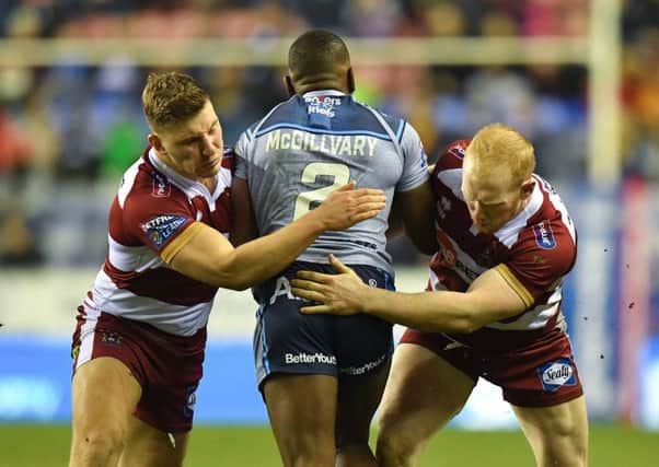 Liam Farrell and George Williams tackle Jermaine McGillvary last Friday