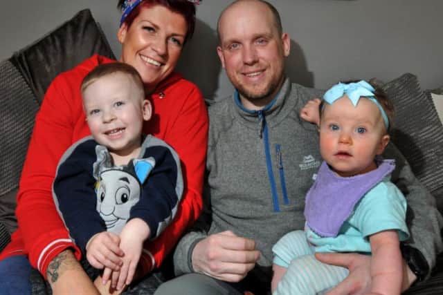Michael Stevenson at home with partner Lauren Highton and their children