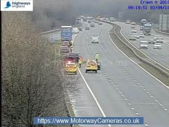A lane on the M61 has been blocked following a two car crash, say police.