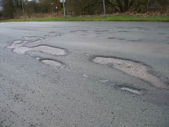 Potholes cost this country millions of pounds to repair says a correspondent